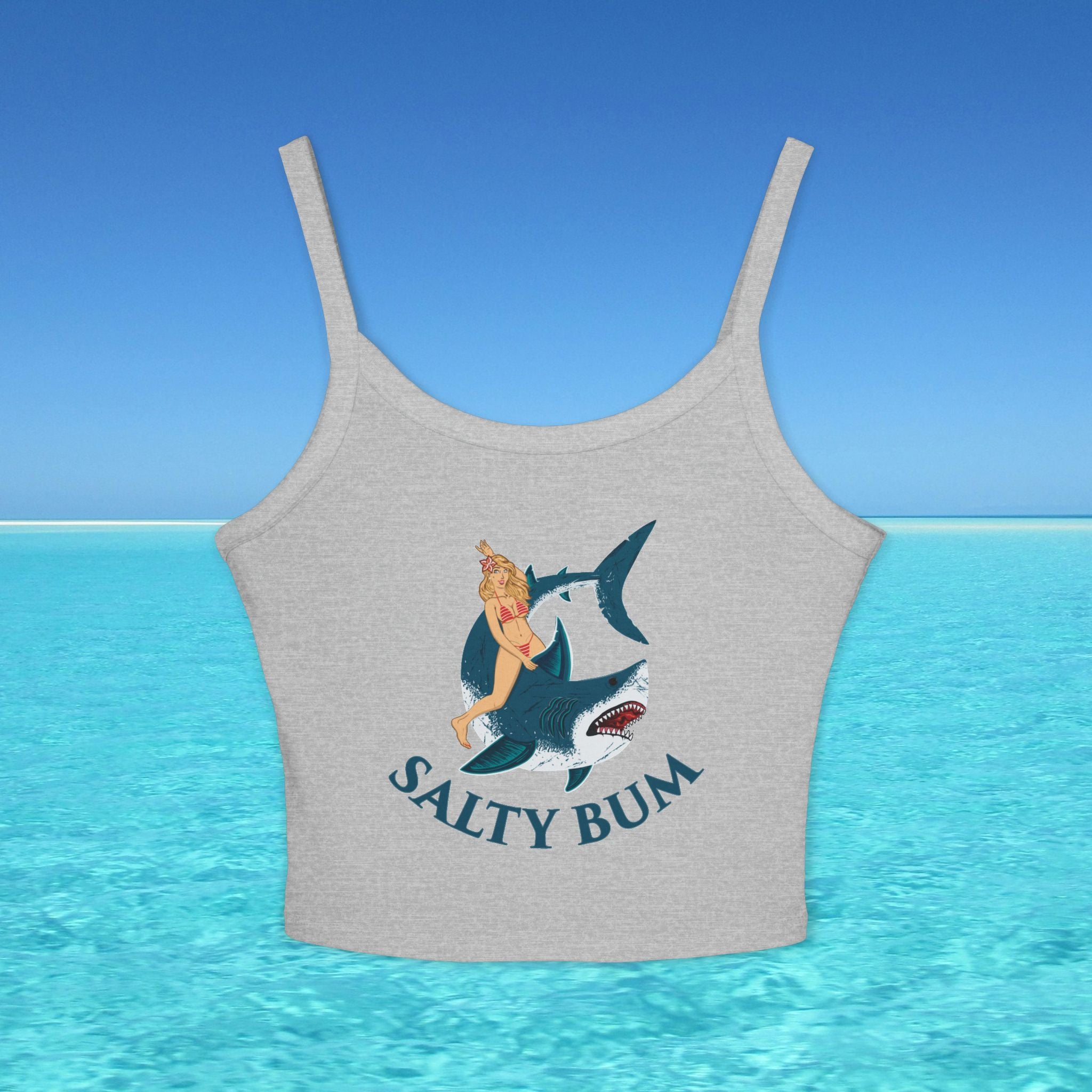 Gray tank top with a graphic of a woman on a shark and 'Salty Bum' text, set against a blue ocean background.