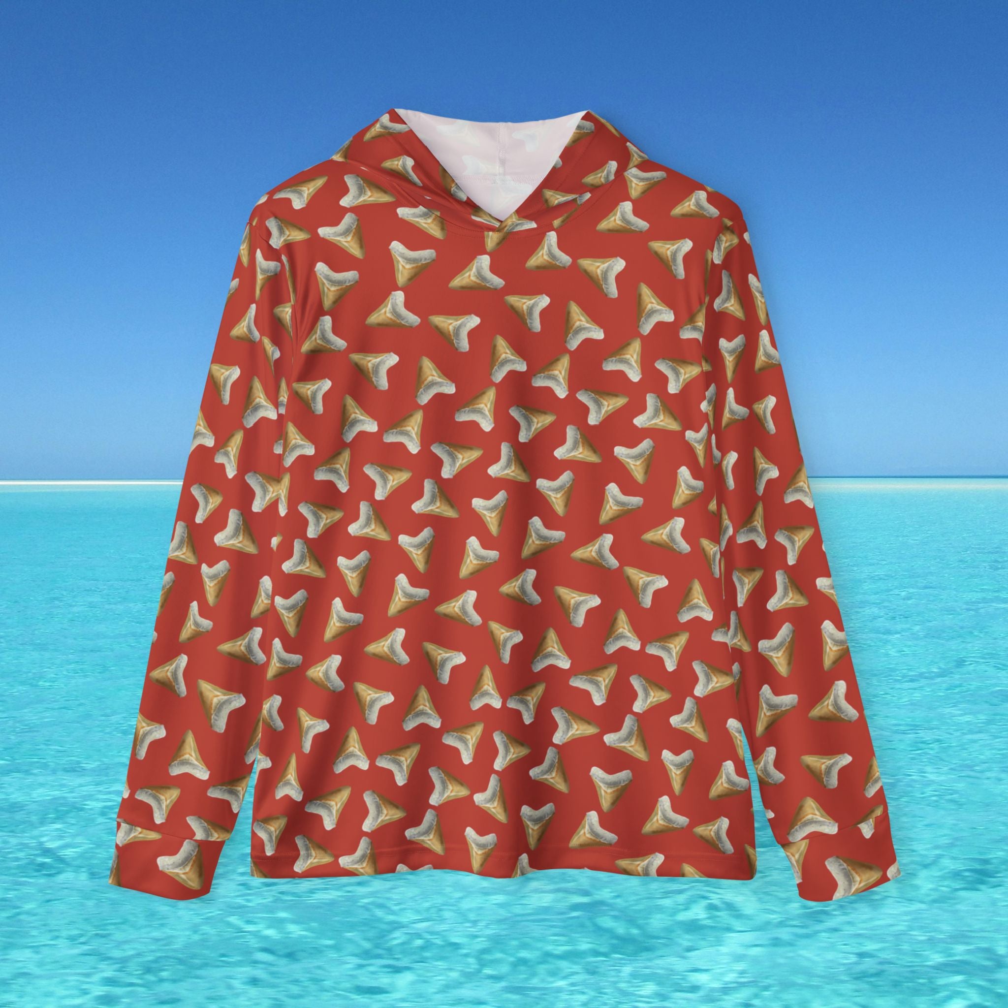 Red hoodie with shark tooth pattern on a blue water and sky background