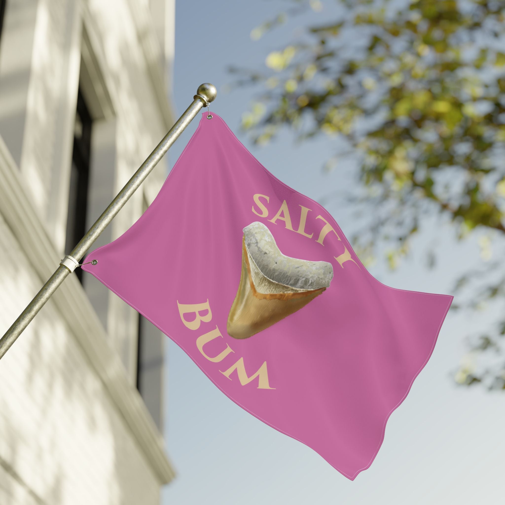 Pink flag with a shark tooth graphic and 'Salty Bum' text, waving in the wind.