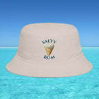 Beige bucket hat with 'Salty Bum' text and ice cream graphic on a blue water and sky background