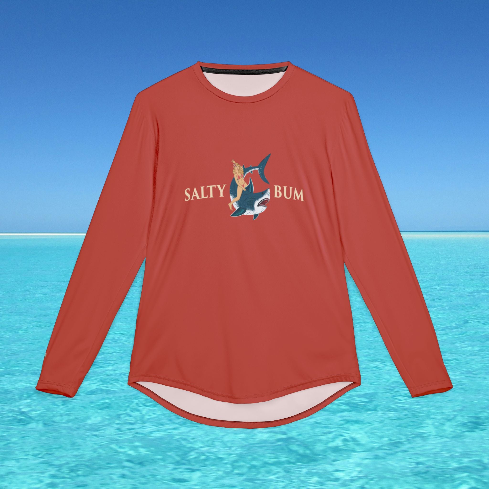 Red long-sleeve shirt with 'Salty Bum' logo on a blue water and sky background