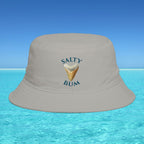 Gray bucket hat with 'Salty Bum' text and ice cream graphic on a blue water and sky background
