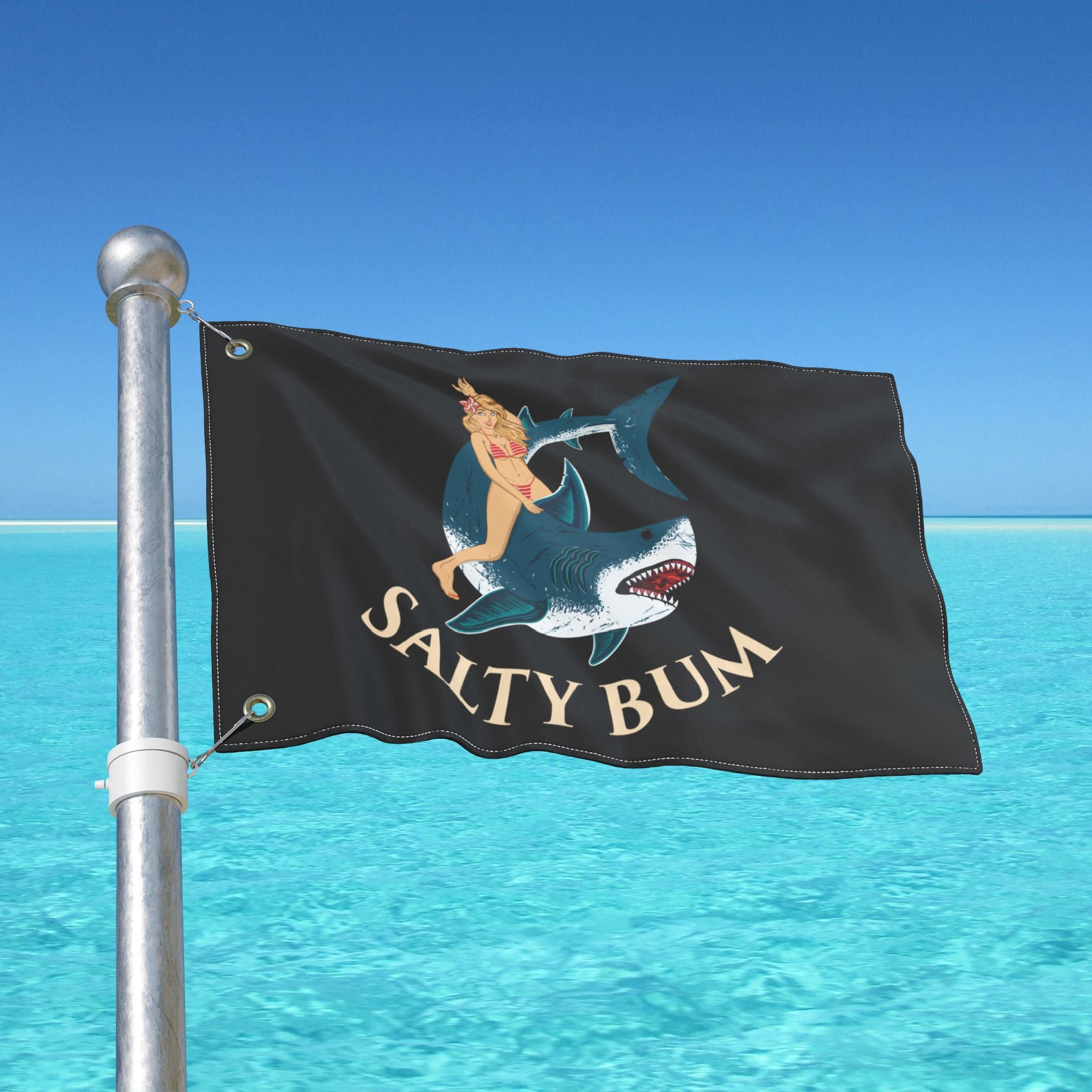 Flag with a graphic of a woman on a shark and 'Salty Bum' text against a blue sky and water background.