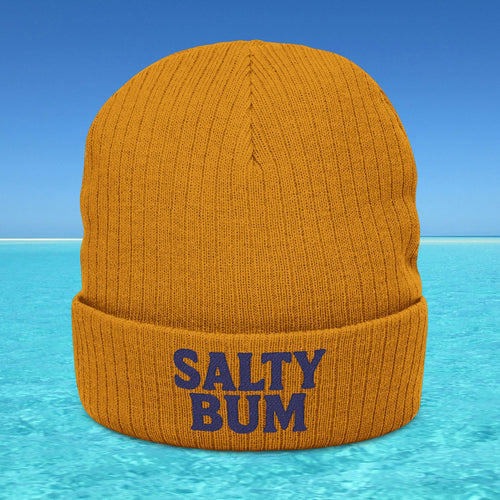 Orange beanie with 'Salty Bum' text on a blue water and sky background