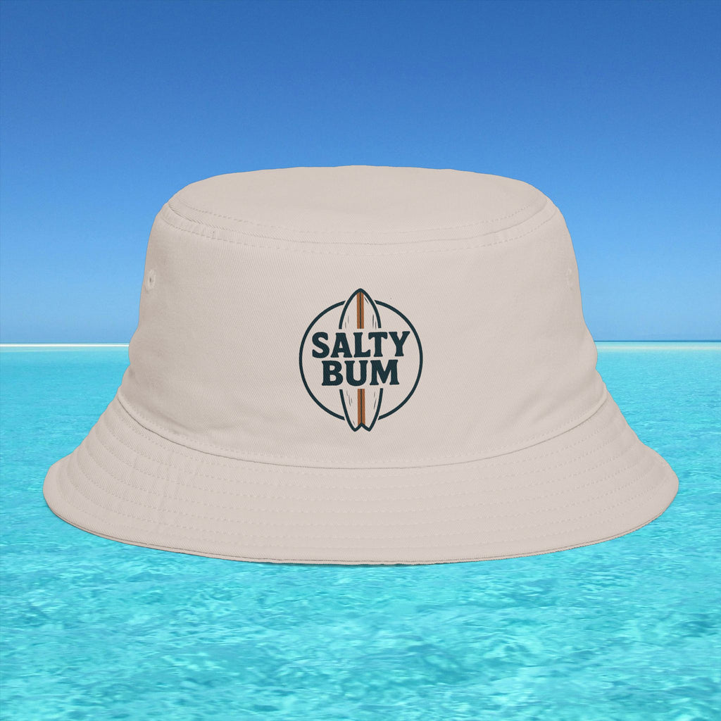 Beige bucket hat with 'Salty Bum' logo on a blue water and sky background