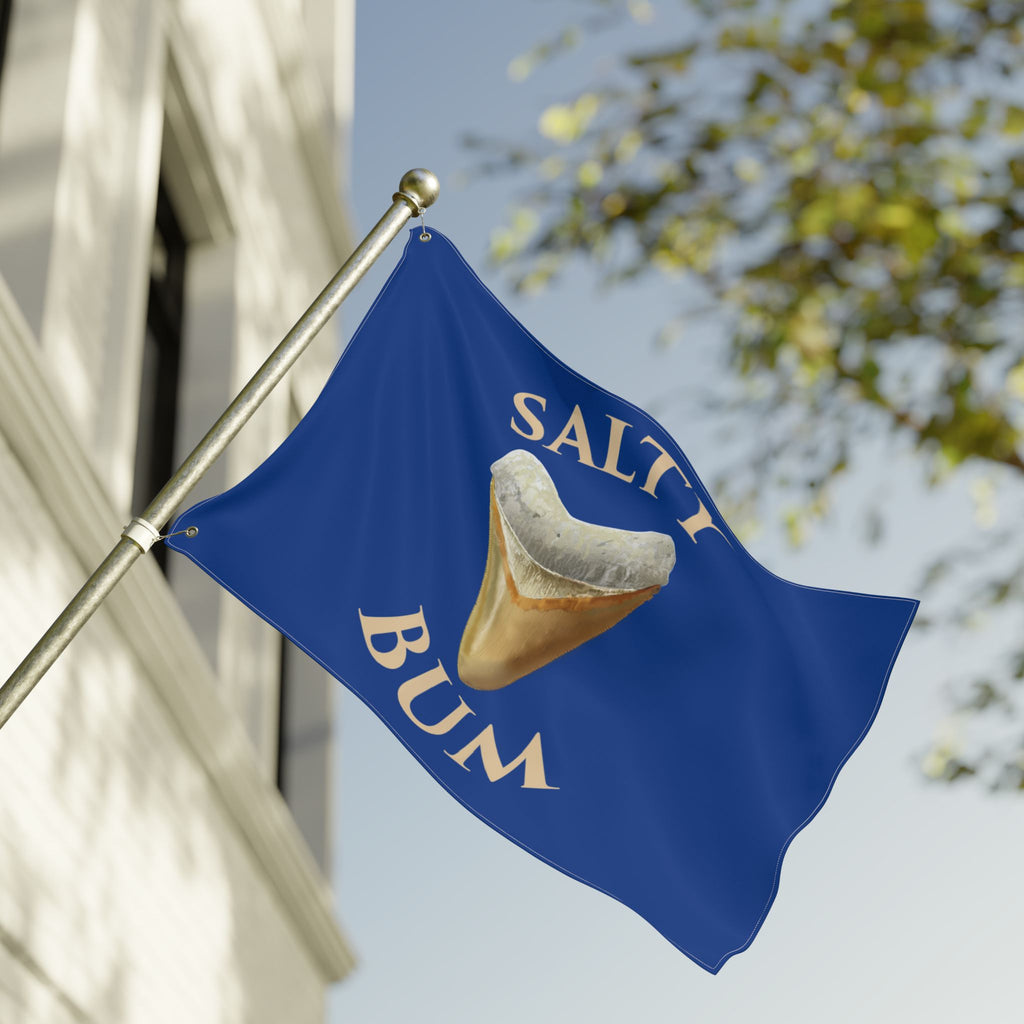 Blue flag with 'Salt Bum' logo featuring a corned beef hash bun on a building facade.