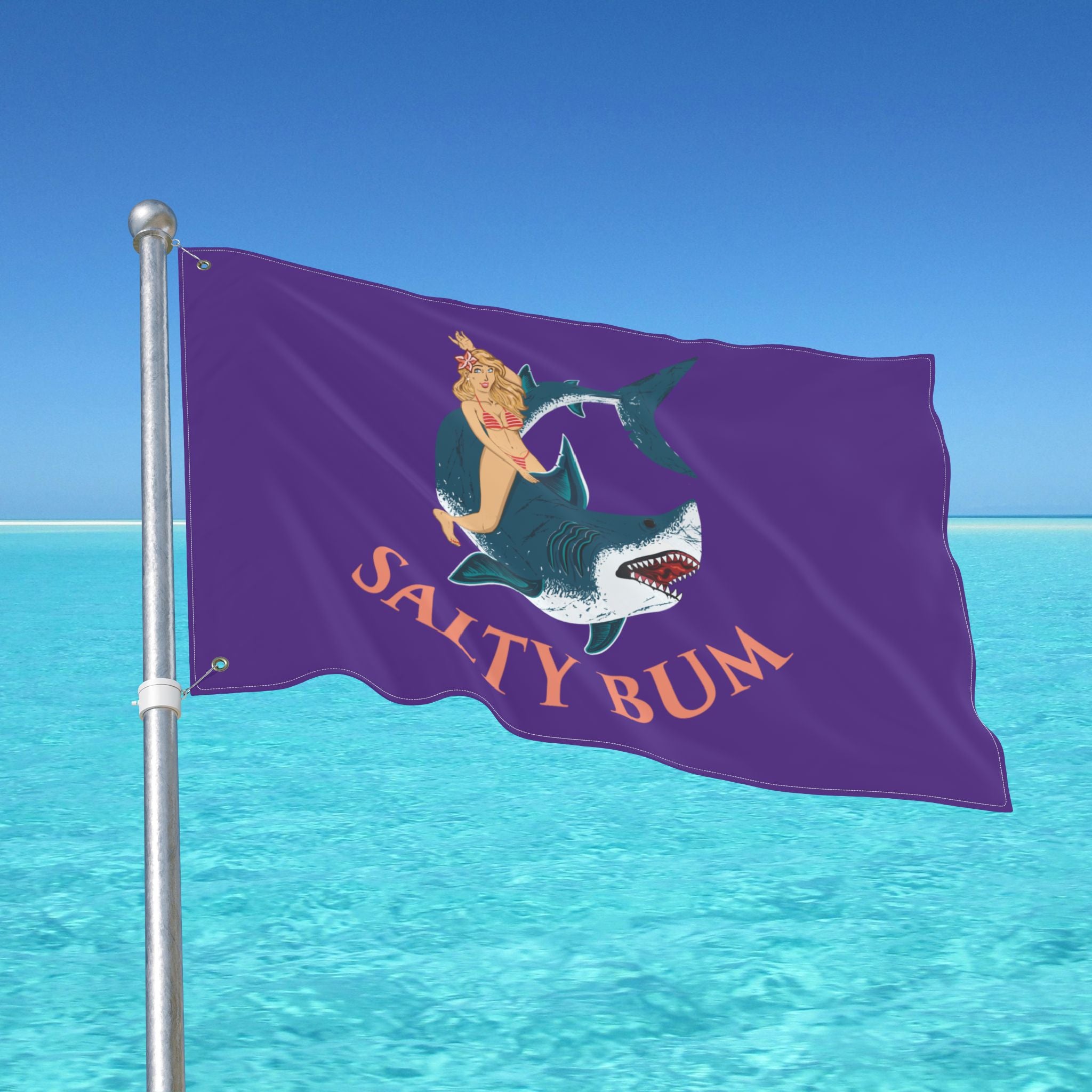 Flag with 'Salty Bum' design on a pole over clear blue water
