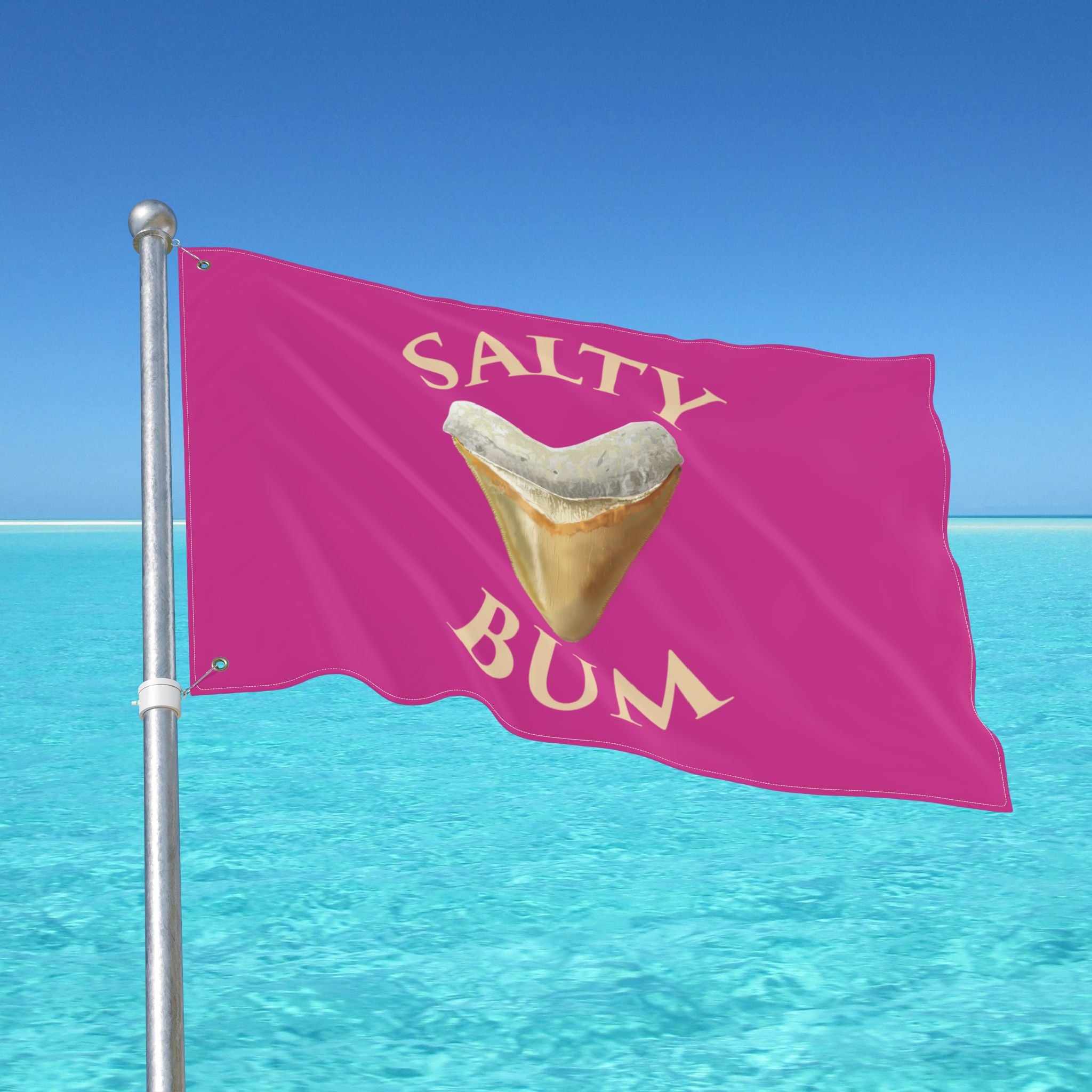 Pink flag with 'Salty Bum' text and a shark tooth graphic against a clear blue sky.