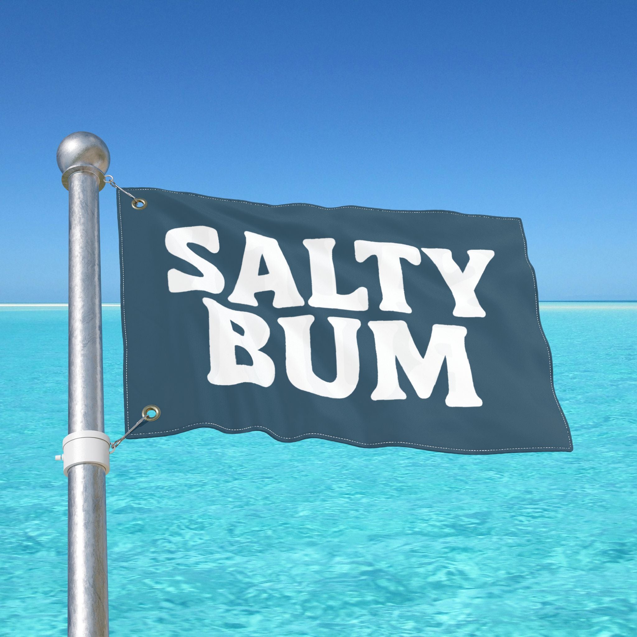 Flag with 'Salty Bum' text against a clear blue sky and ocean.