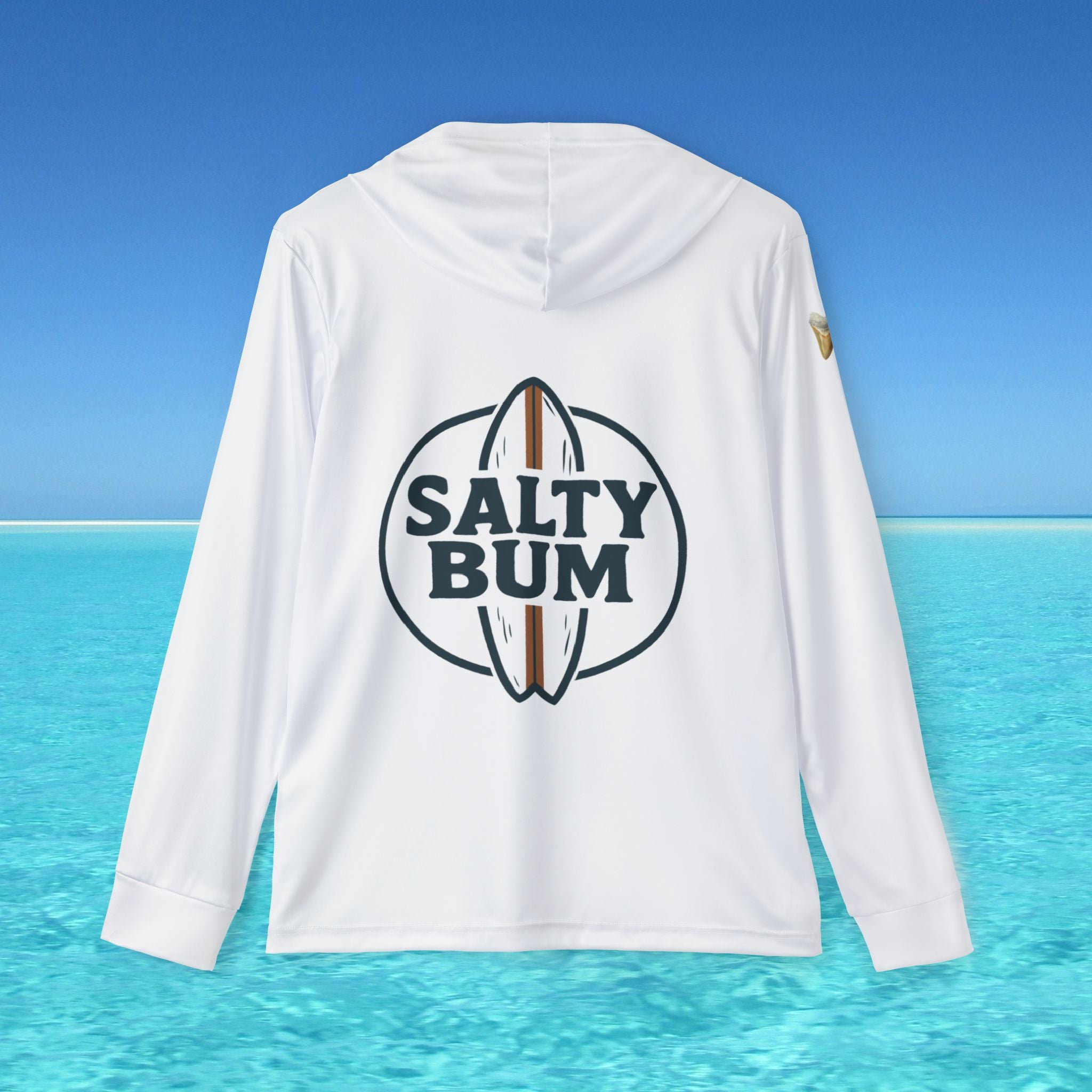 White hoodie with 'Salty Bum' logo on the back against a blue ocean and sky background