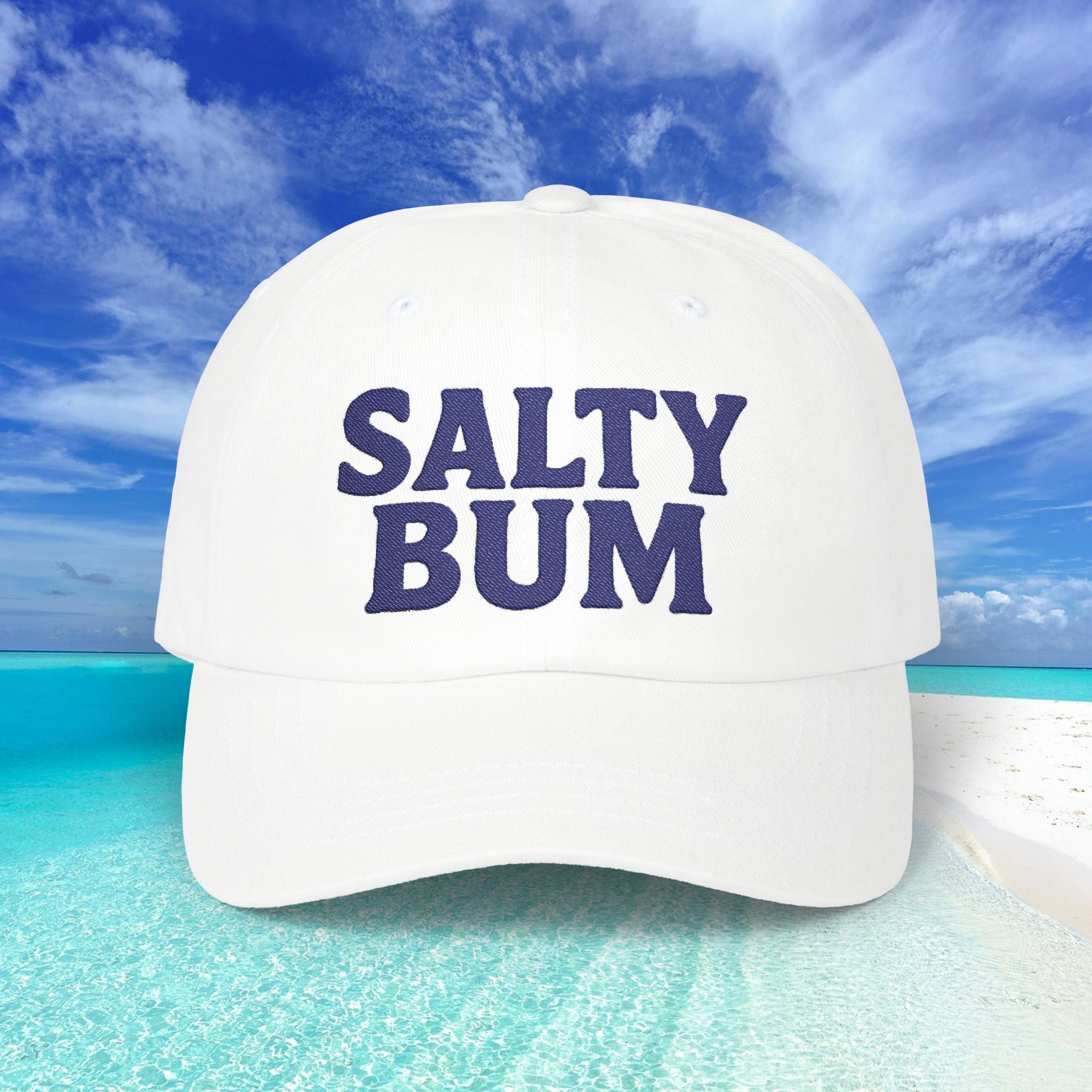 White cap with 'Salty Bum' text against a beach background