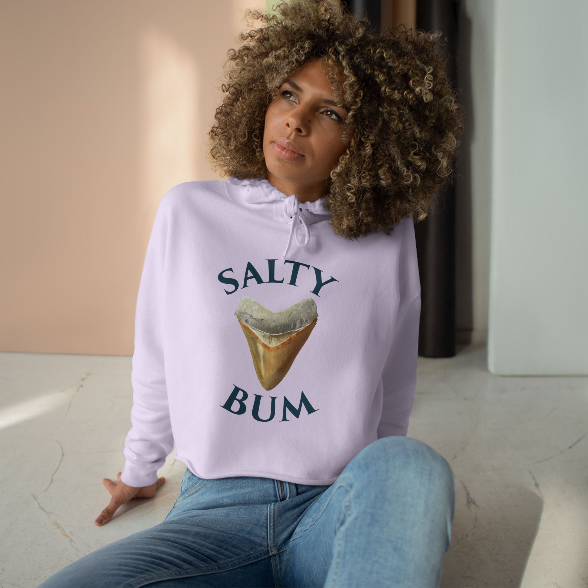Person wearing a hoodie with 'Salty Bum' text and ice cream graphic.