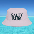 Pink bucket hat with 'Salty Bum' text on a clear blue water background