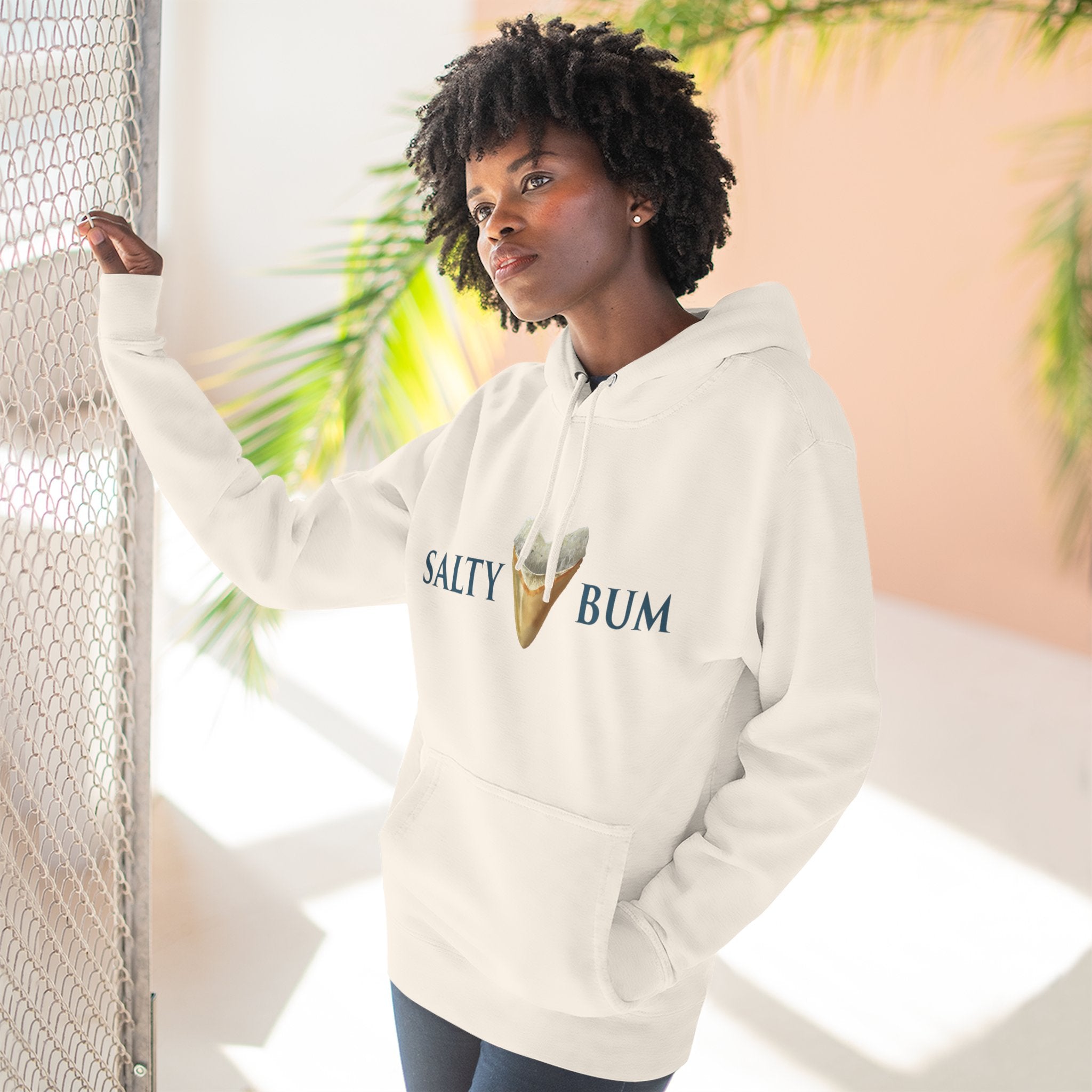 Person wearing a 'Salty Bum' hoodie with an ice cream graphic, standing against a light background.