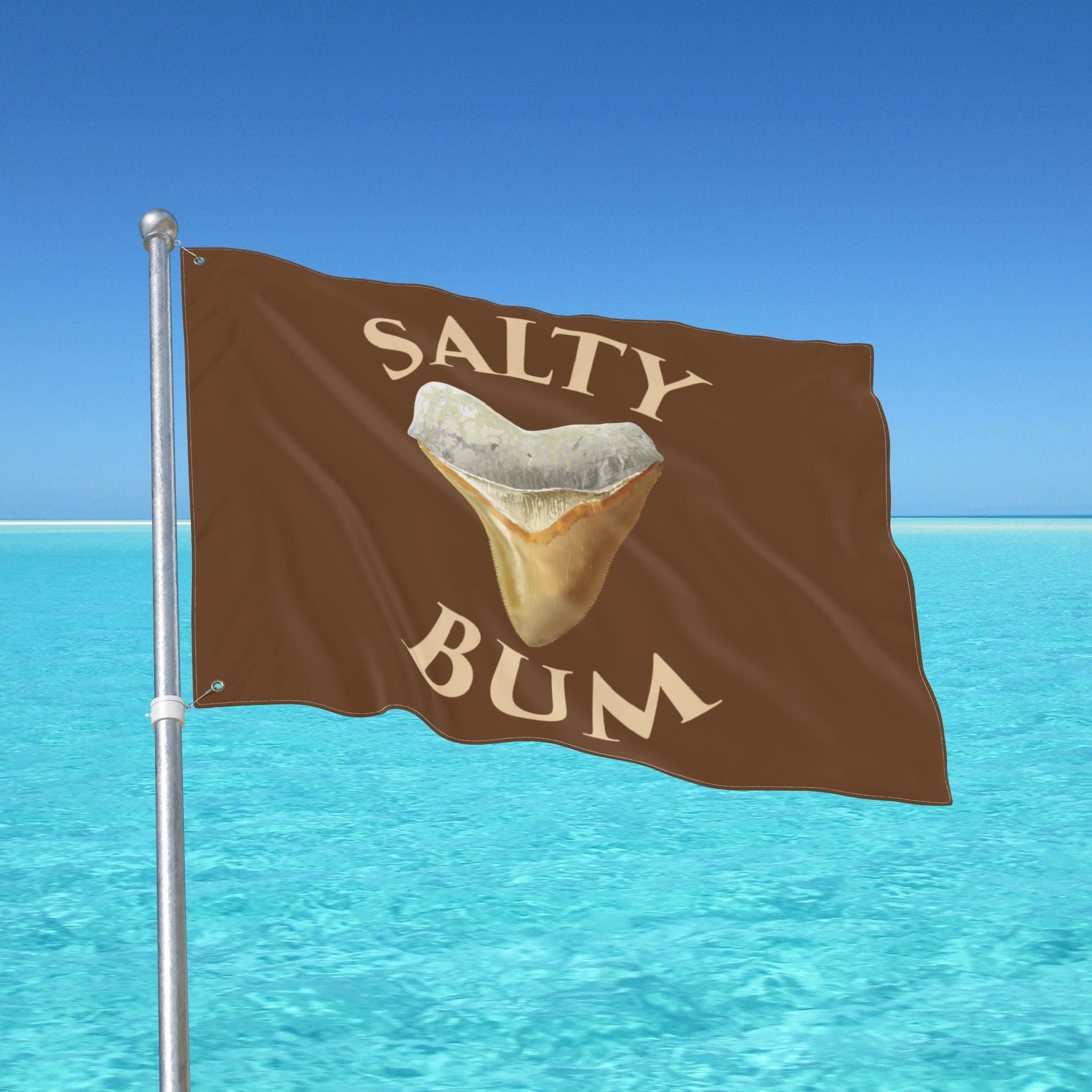 Flag with 'Salty Bum' text and a shark tooth graphic against a blue ocean and sky background.