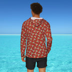 Person wearing a red patterned jacket with a blue ocean and clear sky in the background