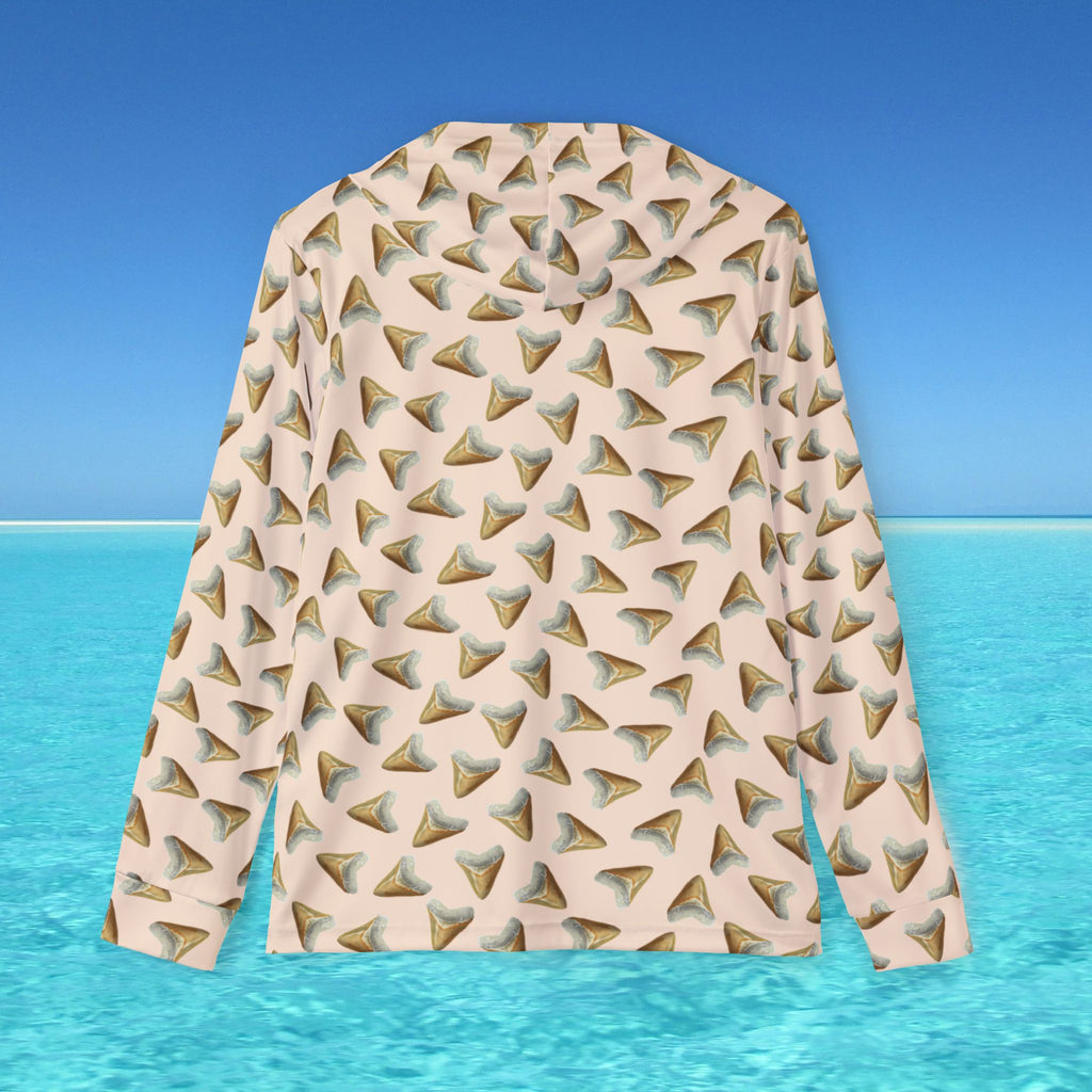 Long-sleeve shirt with geometric pattern on a blue water and sky background