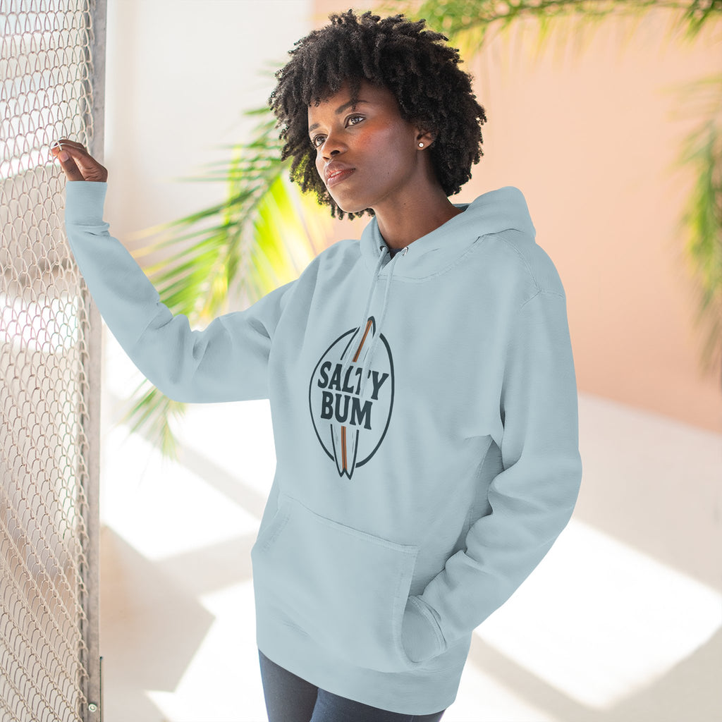 Person wearing a light blue hoodie with 'Salty Bum' logo, standing against a neutral background.