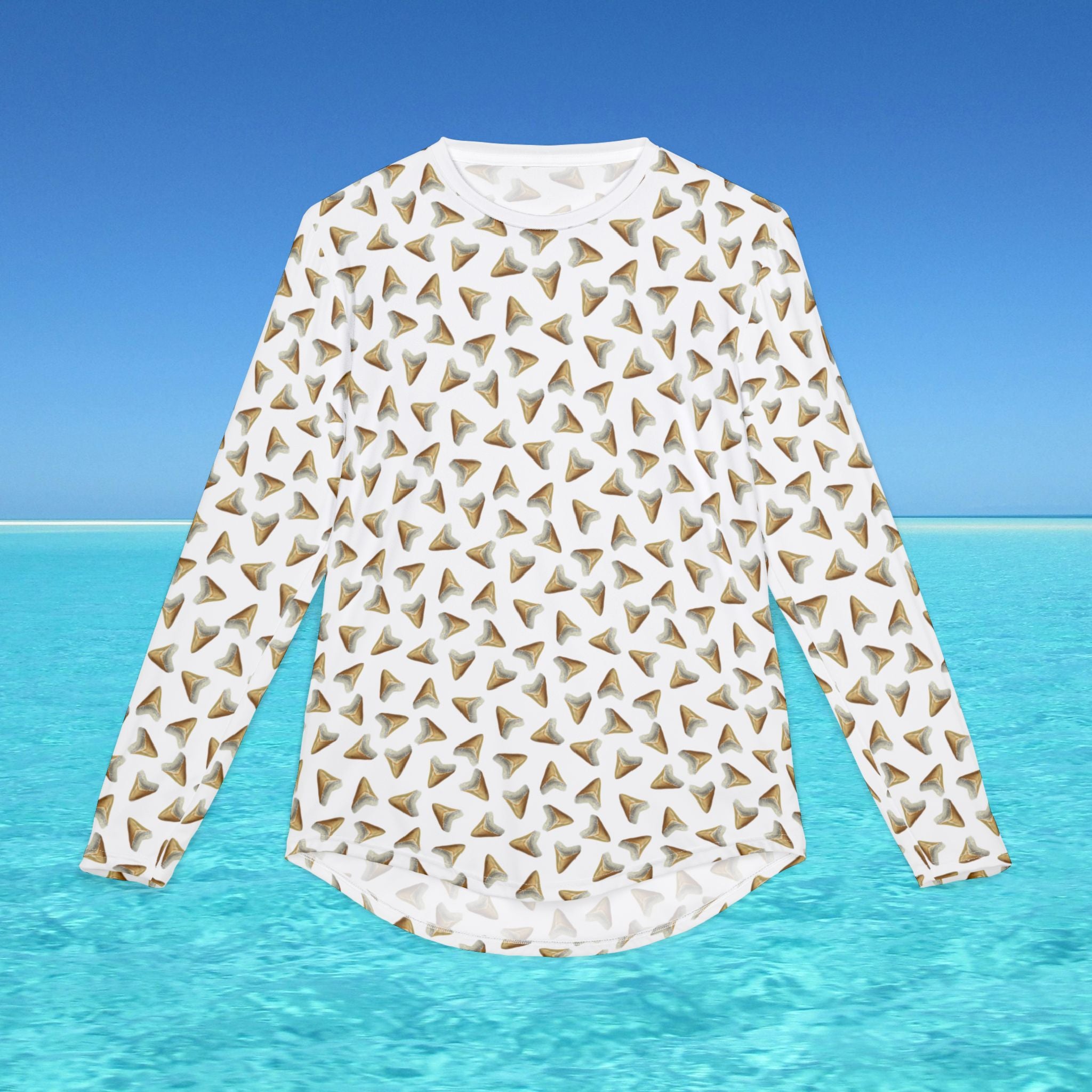White long-sleeve shirt with geometric pattern on a blue water and sky background