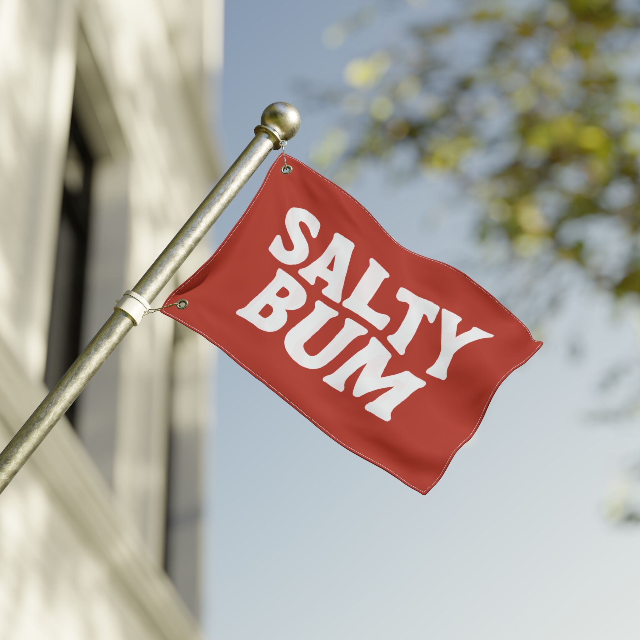 Red flag with 'Salty Bum' text on a blurred background