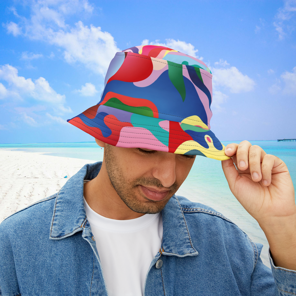 Person holding a colorful bucket hat against a beach background