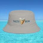 Gray bucket hat with 'Salty Bum' text and shark tooth graphic on a blue water and sky background