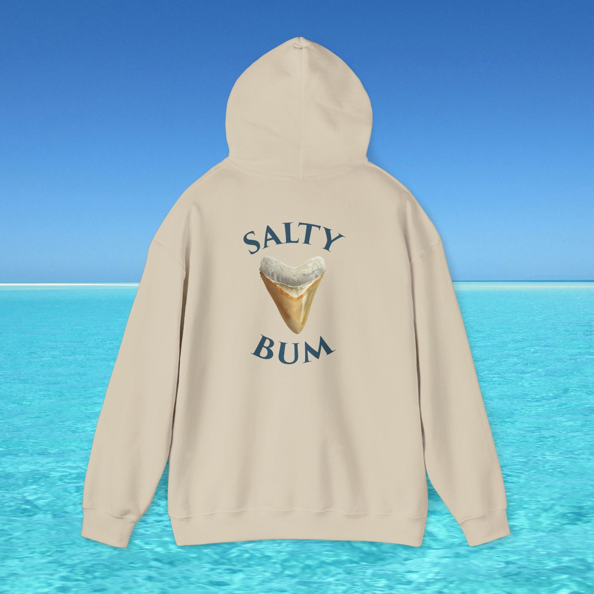 Beige hoodie with 'Salty Bum' text and ice cream graphic on a blue water and sky background
