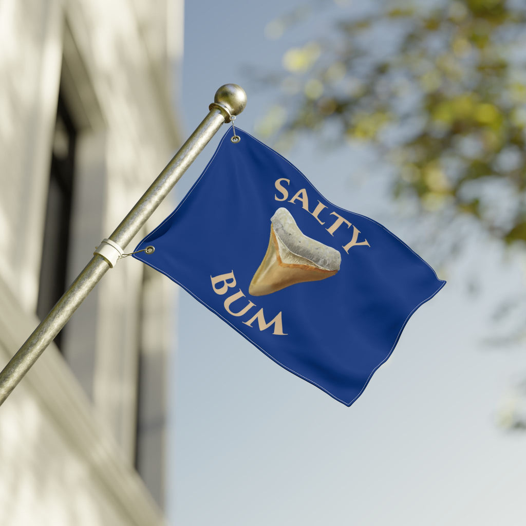 Blue flag with 'Salty Bum' text and a graphic of a sand dollar on a blurred background
