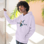 Person wearing a light purple hoodie with a logo and text, standing against a neutral background.