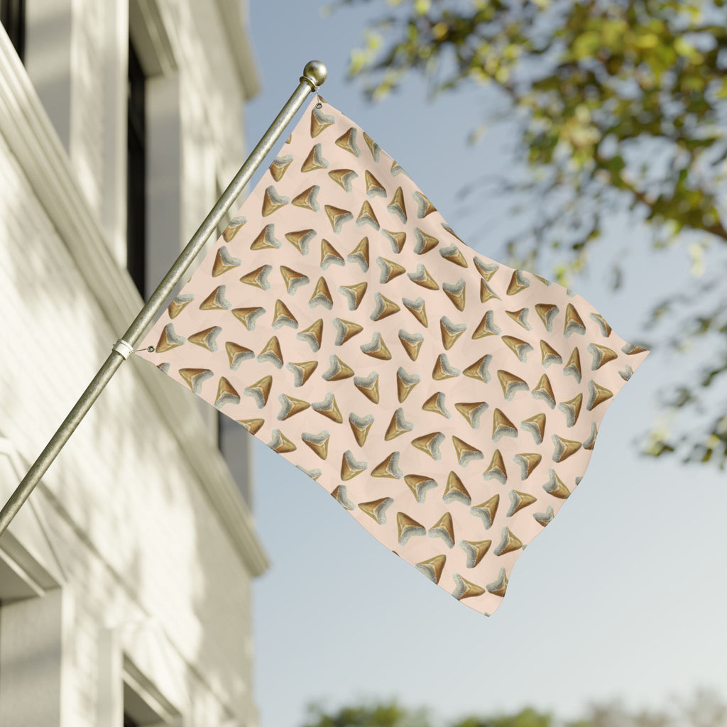 Decorative metal flag with geometric pattern on a building