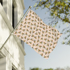 Decorative metal flag with geometric pattern on a building