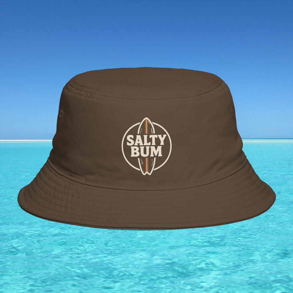 Brown bucket hat with 'Salty Bum' logo on a blue water and sky background