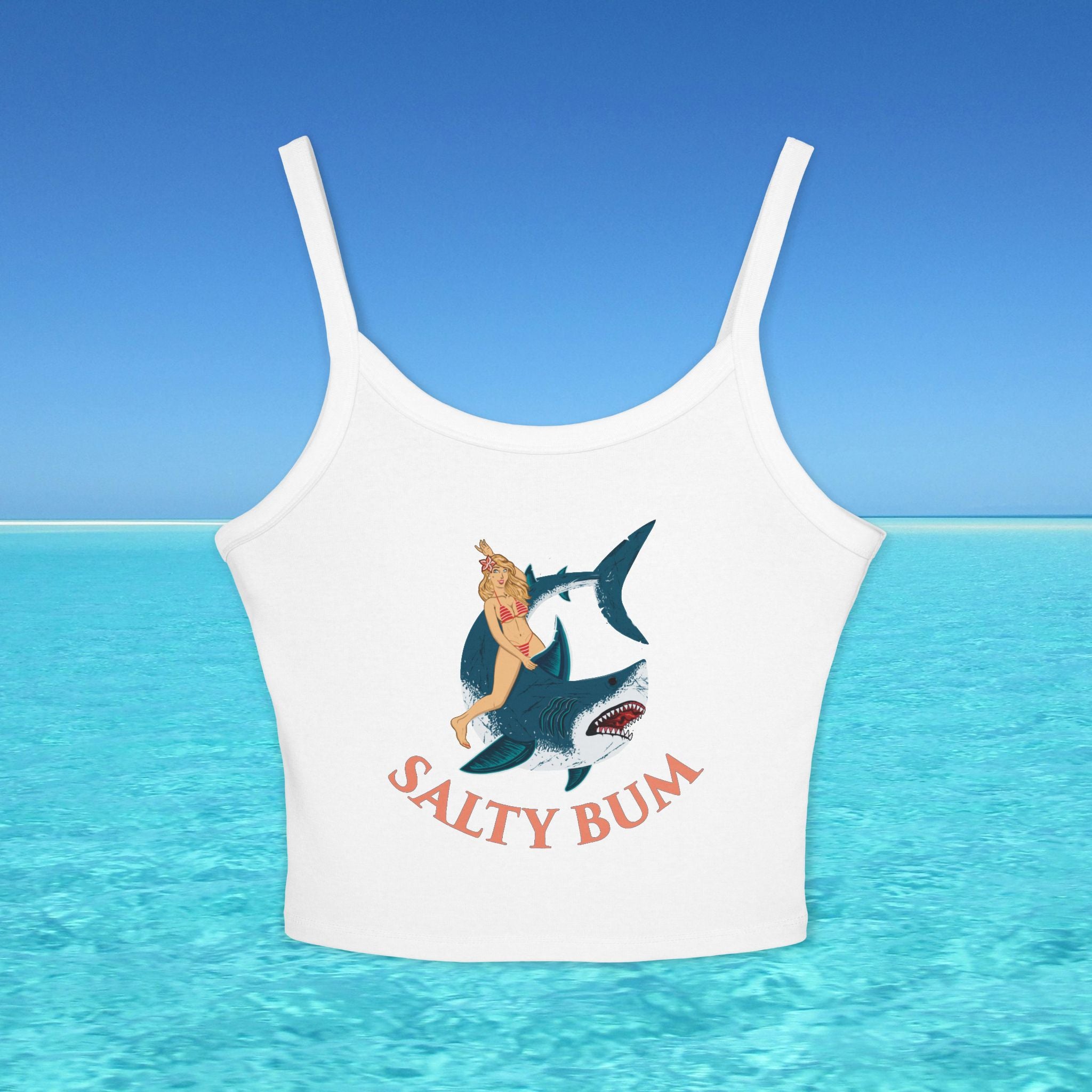 White tank top with a shark and bikini graphic and 'Salty Bum' text on a blue water background
