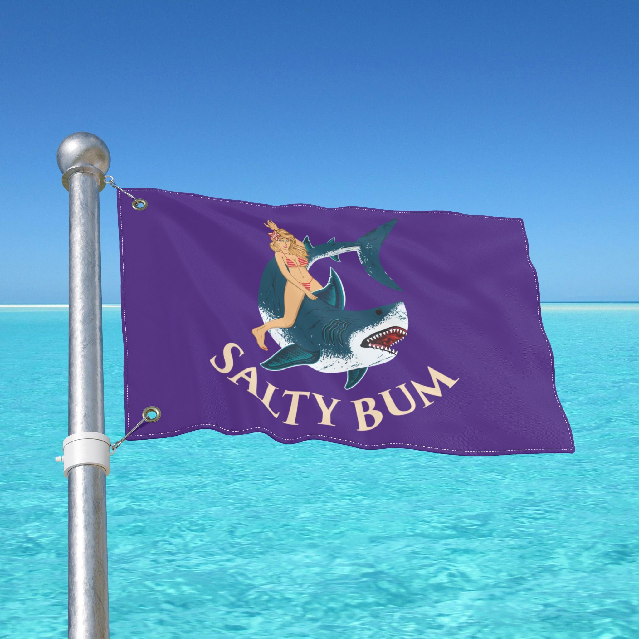 Flag with 'Salty Bum' design on a pole over clear blue water