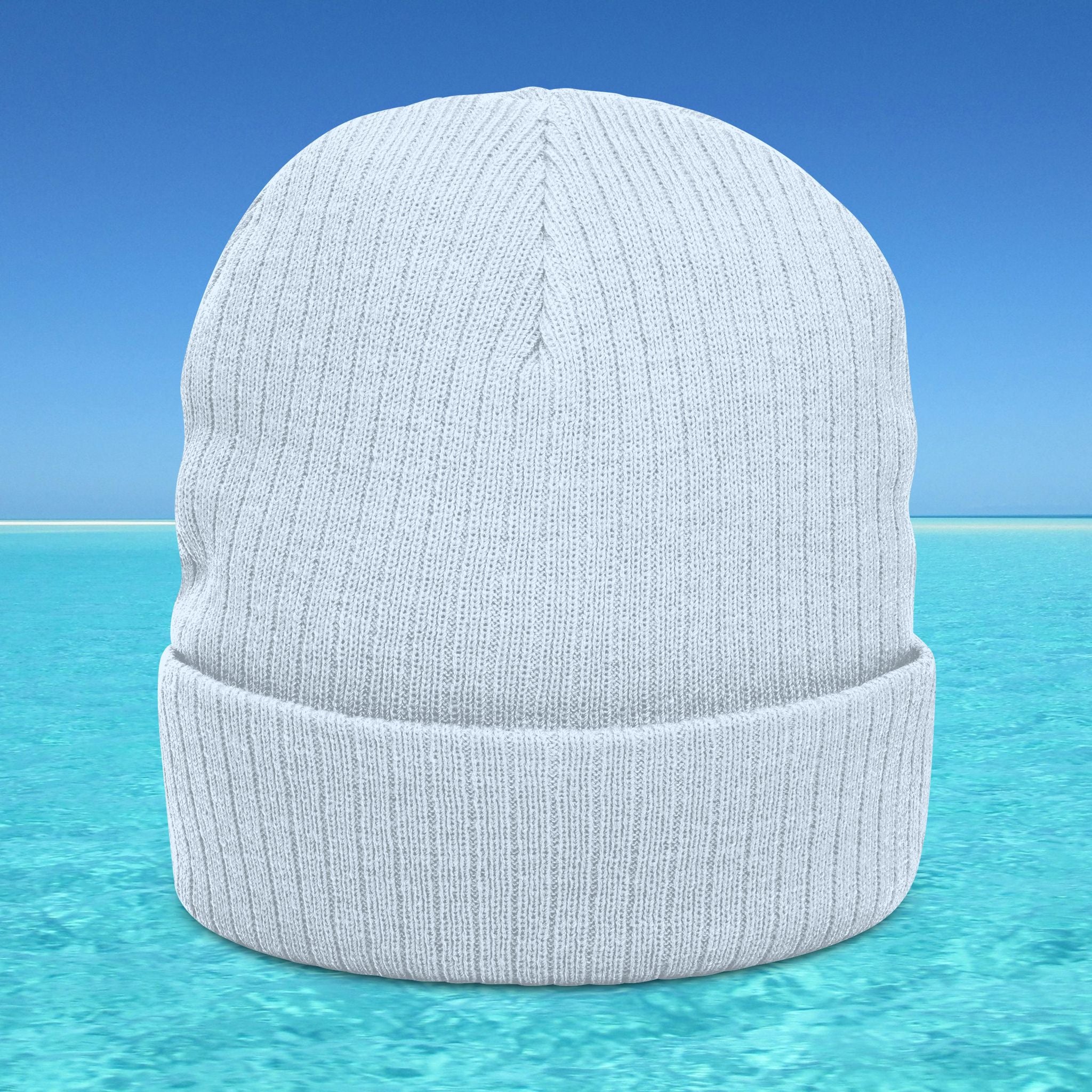 Gray beanie on a clear blue water background