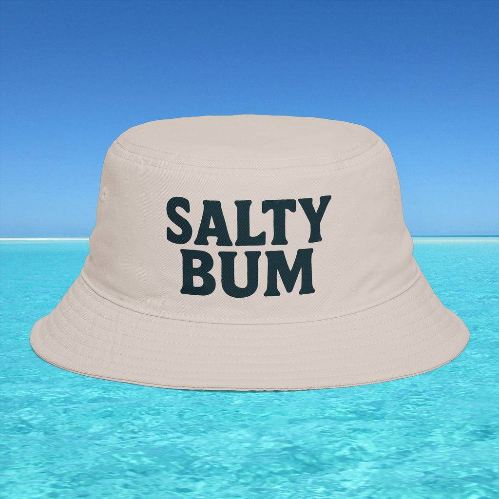 Beige bucket hat with 'Salty Bum' text on a blue water and sky background