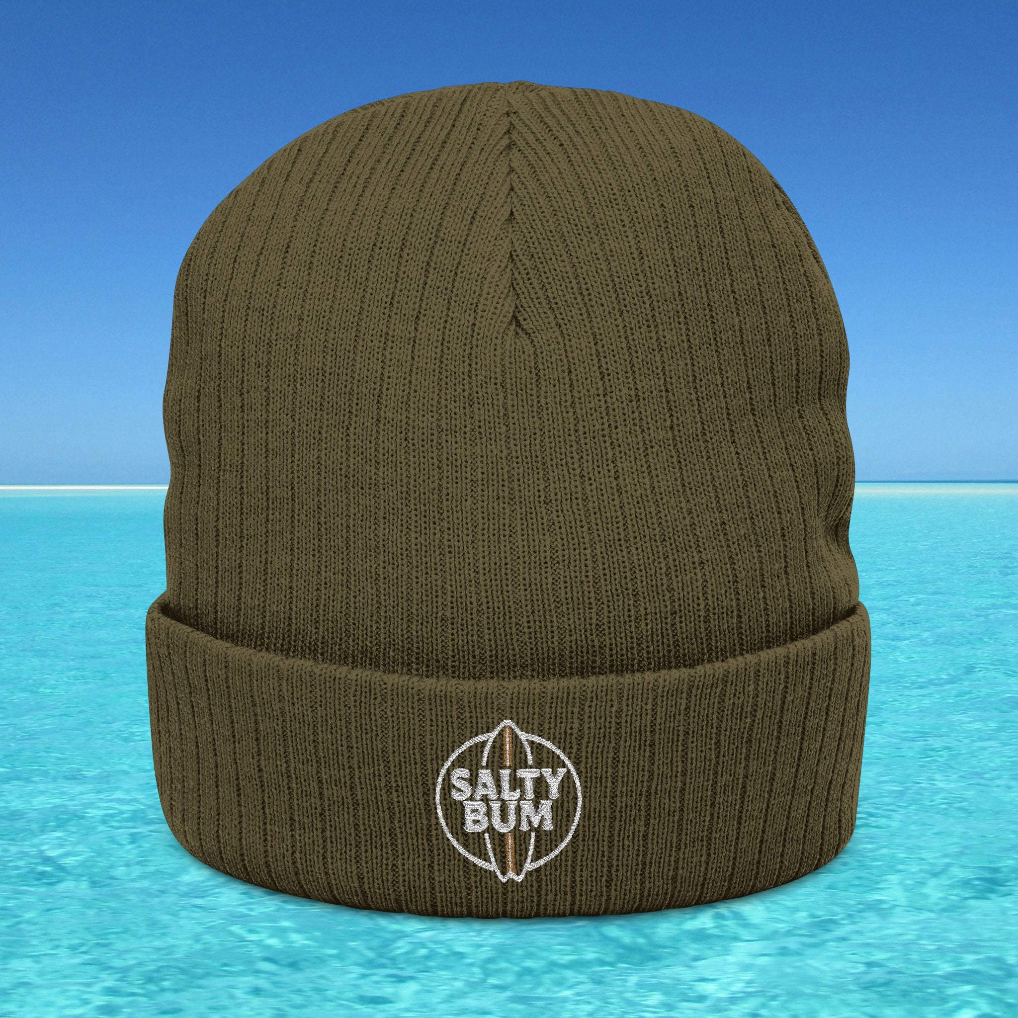 Brown beanie with 'Salty Bum' logo on a blue water and sky background
