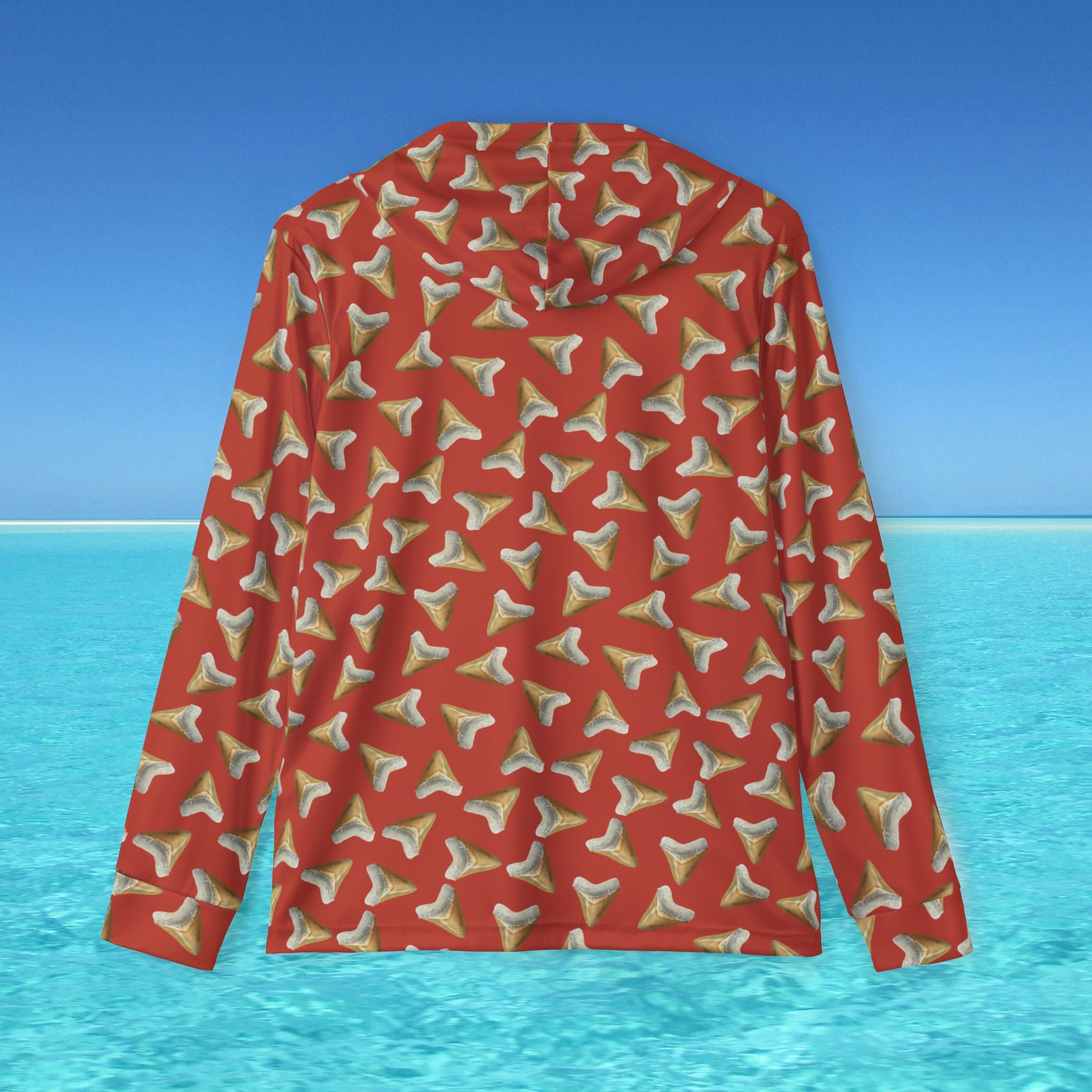Red hoodie with shark tooth pattern on a blue water and sky background