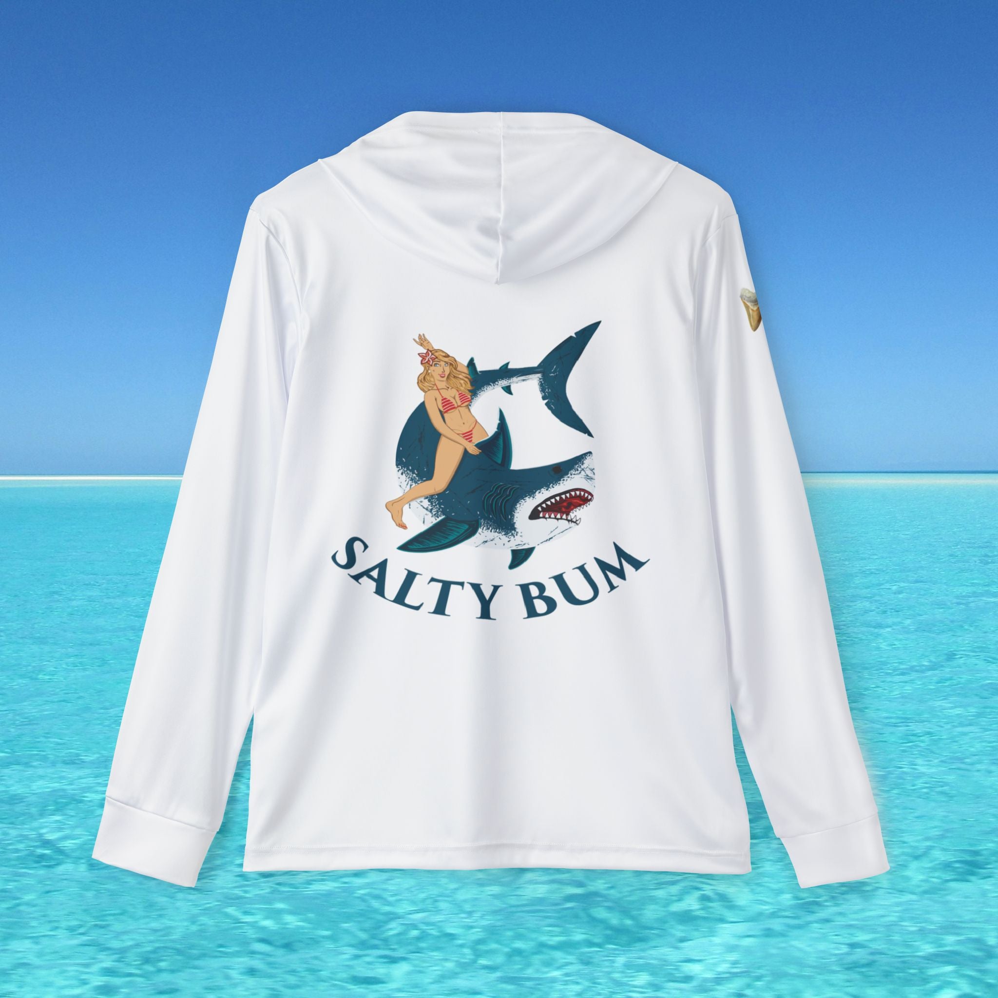 White long-sleeve shirt with a graphic design of a woman on a shark and 'Salty Bum' text, set against a blue ocean and sky background.