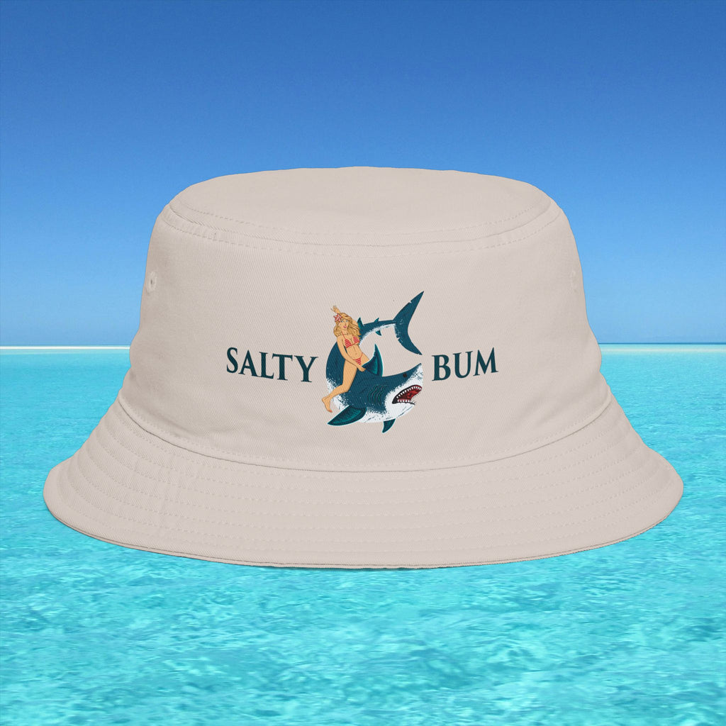 Beige bucket hat with 'Salty Bum' design on a blue water and sky background