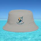 Beige bucket hat with 'Salty Bum' logo on a blue water and sky background