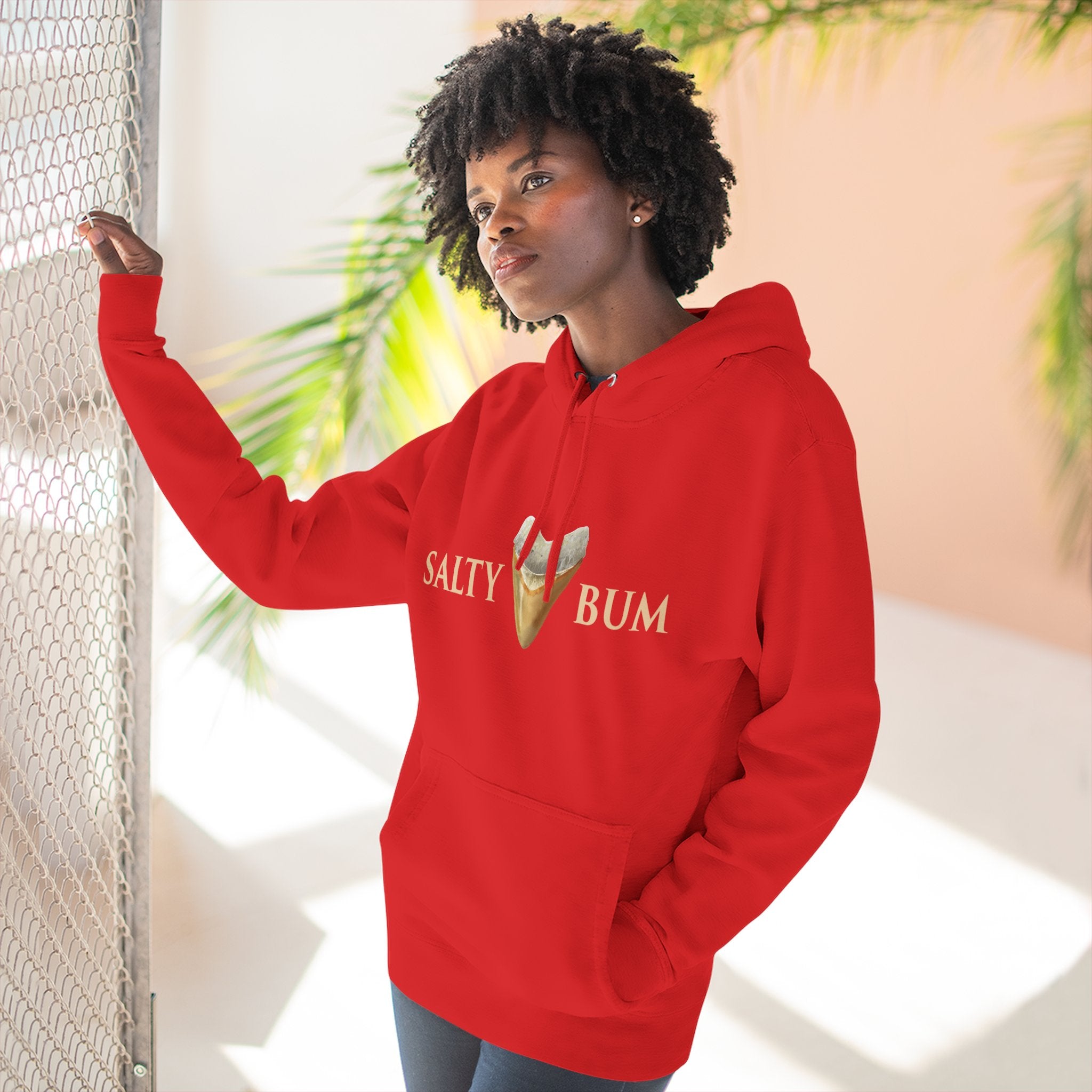 Person wearing a red hoodie with 'Salty Bum' text and ice cream graphic.