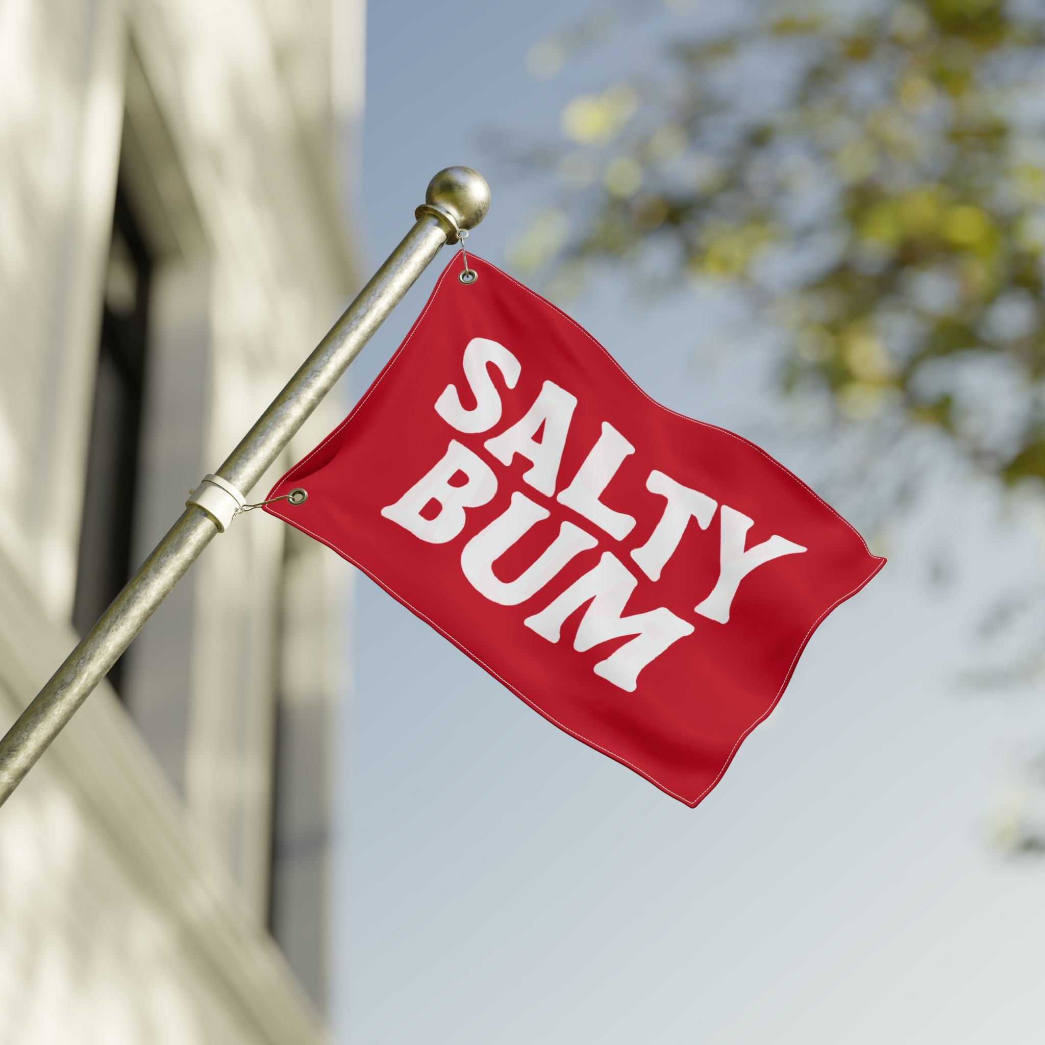 Red flag with 'Salty Bum' text on a blurred background
