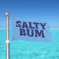 Flag with 'Salty Bum' text against a clear blue sky and ocean background