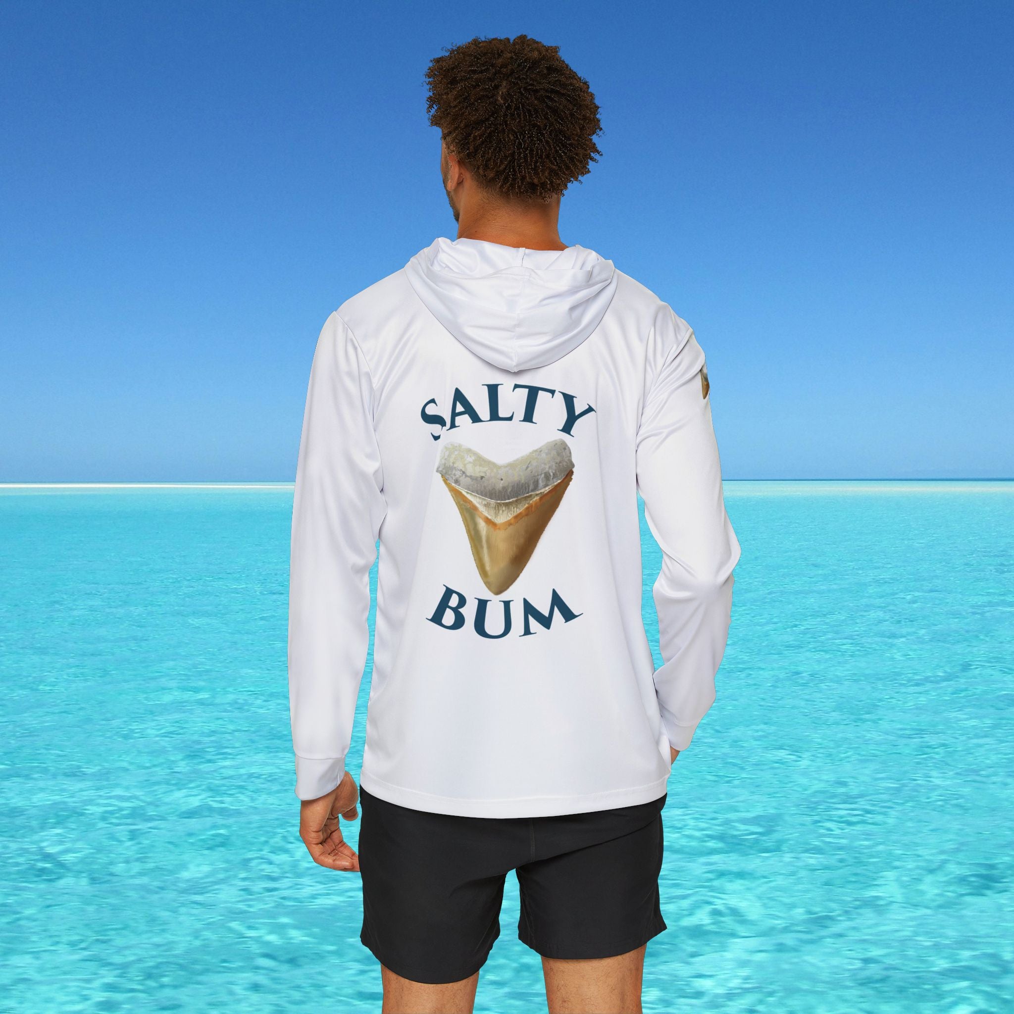 Person wearing a white hoodie with 'Salty Bum' text and ice cream graphic against a clear blue sky.