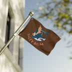 Flag with 'Salty Bum' design on a pole against a blurred background