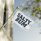 Flag with 'Salty Bum' text on a pole against a blurred background