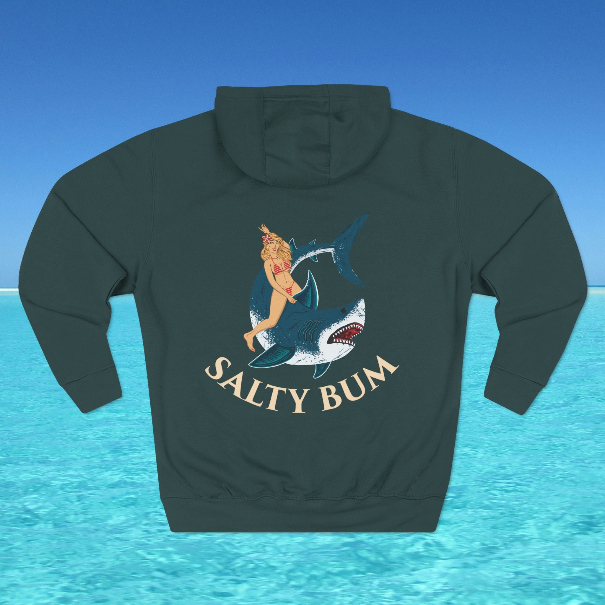 Hoodie with a graphic of a woman on a shark and 'Salty Bum' text against a blue water background