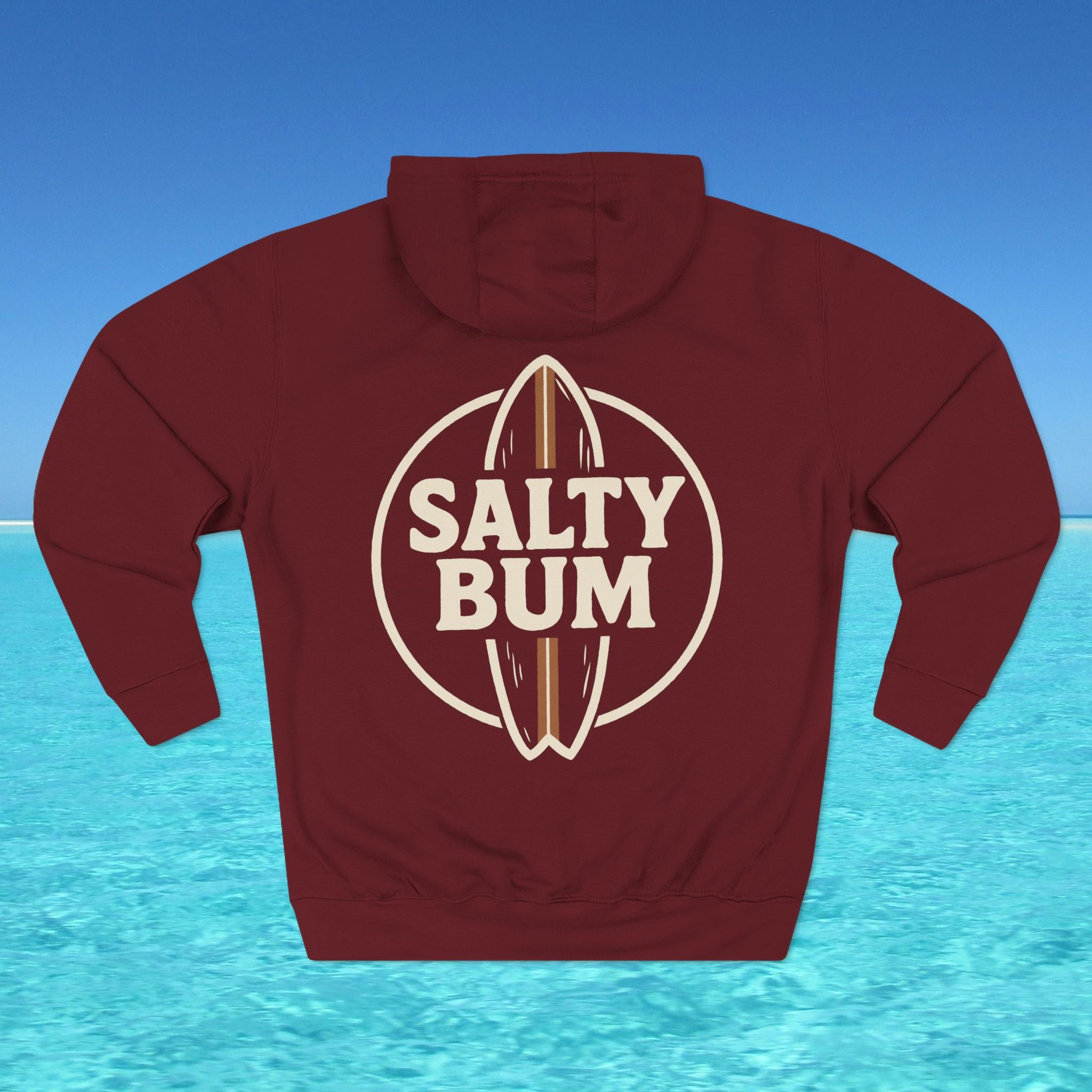 Maroon hoodie with 'Salty Bum' logo on a blue water and sky background