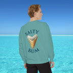 Person wearing a teal sweatshirt with 'Salty Bum' text and ice cream graphic, standing against a blue ocean background.
